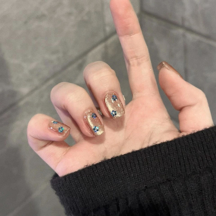 Glittering artificial nails with floral design Stornfield