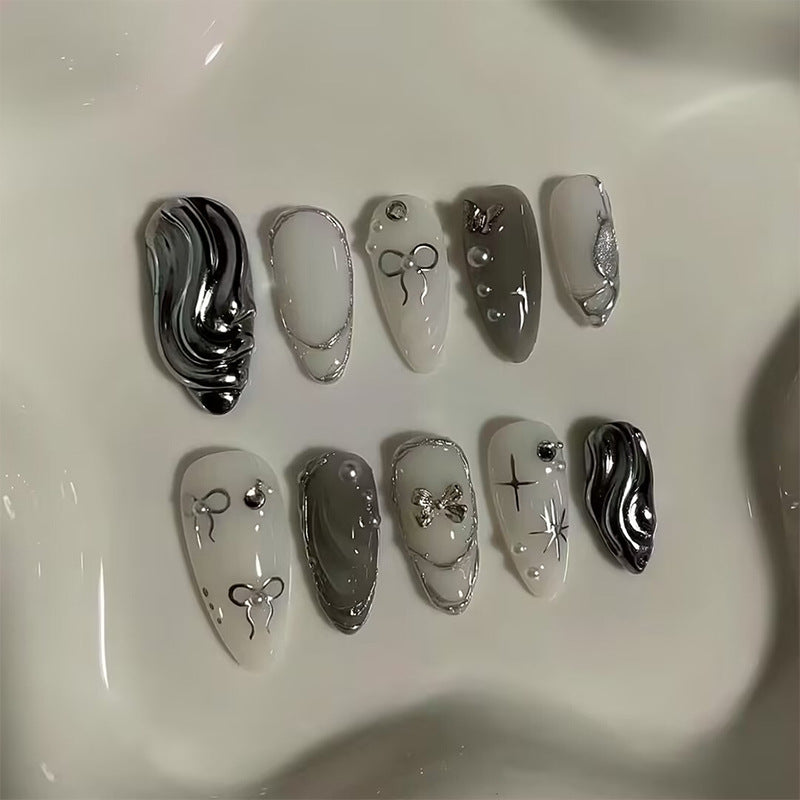 Nail set with luxurious 3D decorations and elegant stone accents Stornfield