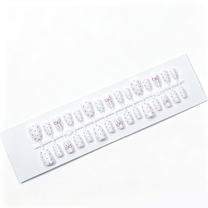 Artificial nail set with delicate dots and bow pattern Stornfield