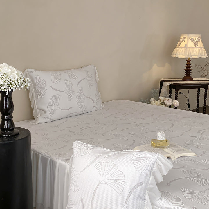 Quilted bedspread set with ginkgo leaf relief, ruffled bed skirt and pillowcases