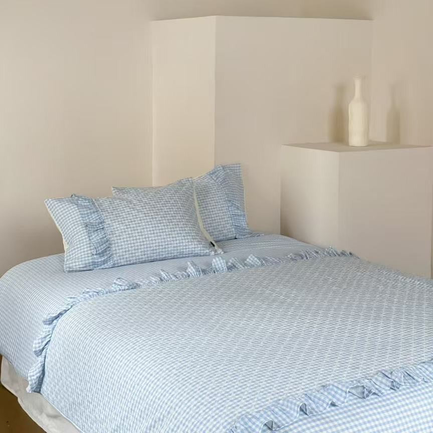 Quilted bedding set with Vichy check and decorative ruffle trim