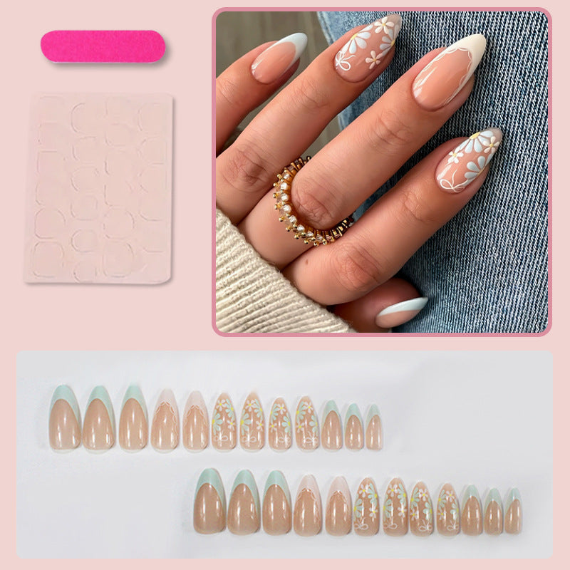 Acrylic nail set with floral accents and elegant tips Stornfield