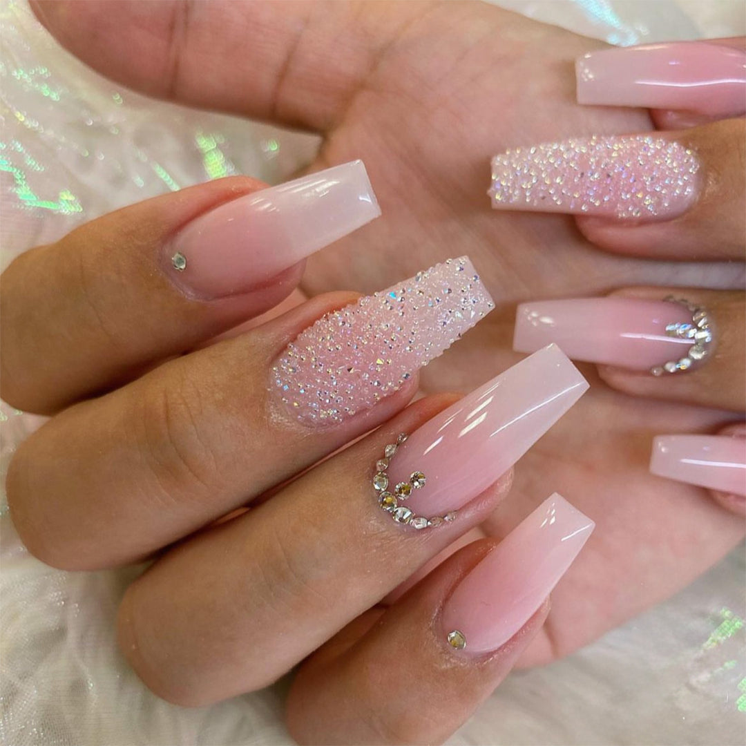 Artificial nail set with elegant glitter and flower decorations Stornfield
