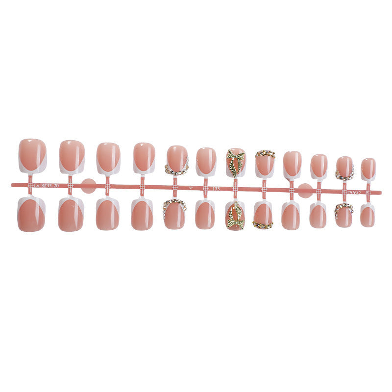 Artificial nail set with elegant glitter and flower decorations Stornfield