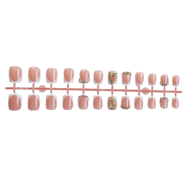 Artificial nail set with elegant glitter and flower decorations Stornfield
