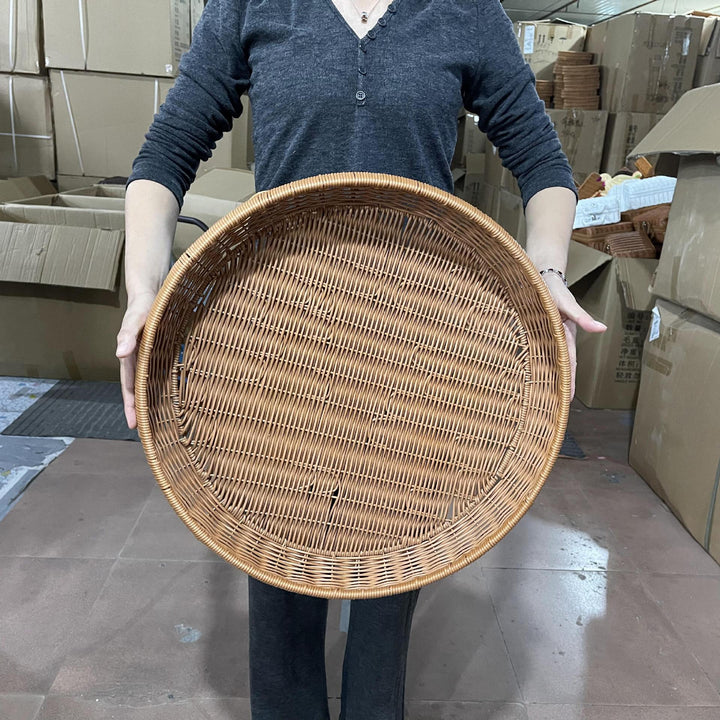Women’s round serving basket made of woven rattan Stornfield