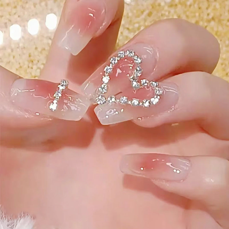 Artificial nails with romantic heart decorations Stornfield