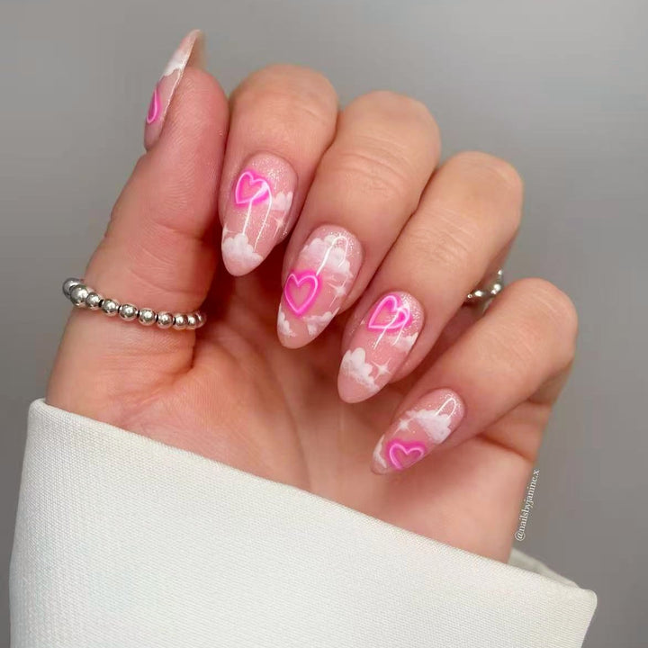 Artificial nail set with romantic heart accents and sparkling finish Stornfield