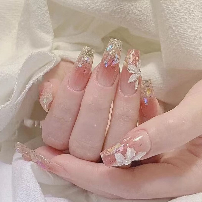 Artificial nails with glitter accents and playful motifs Stornfield