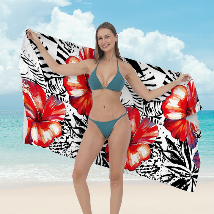 Beach towel with vibrant tropical plant motif Stornfield