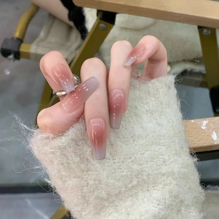 Glamorous artificial nails with delicate flower and glitter effects Stornfield