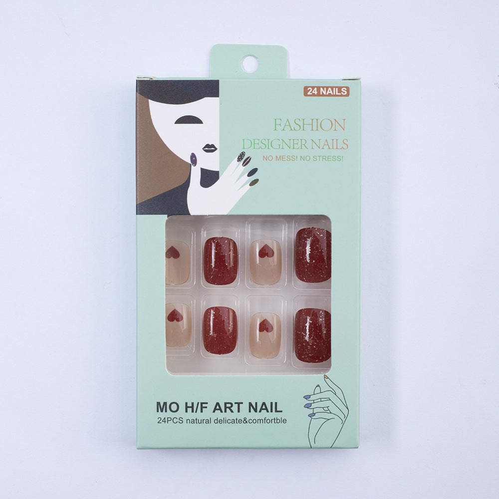 Art nail set with heart designs and glitter Stornfield