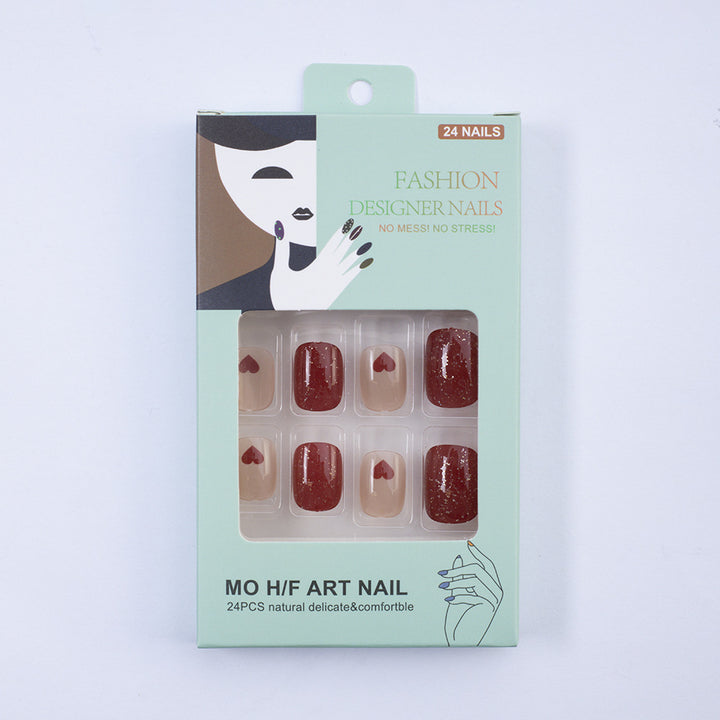 Art nail set with heart designs and glitter Stornfield