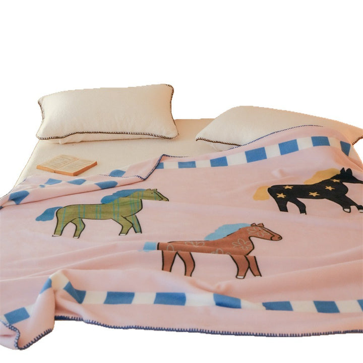 Children's cuddly blanket made of soft fleece with horse print and decorative edge