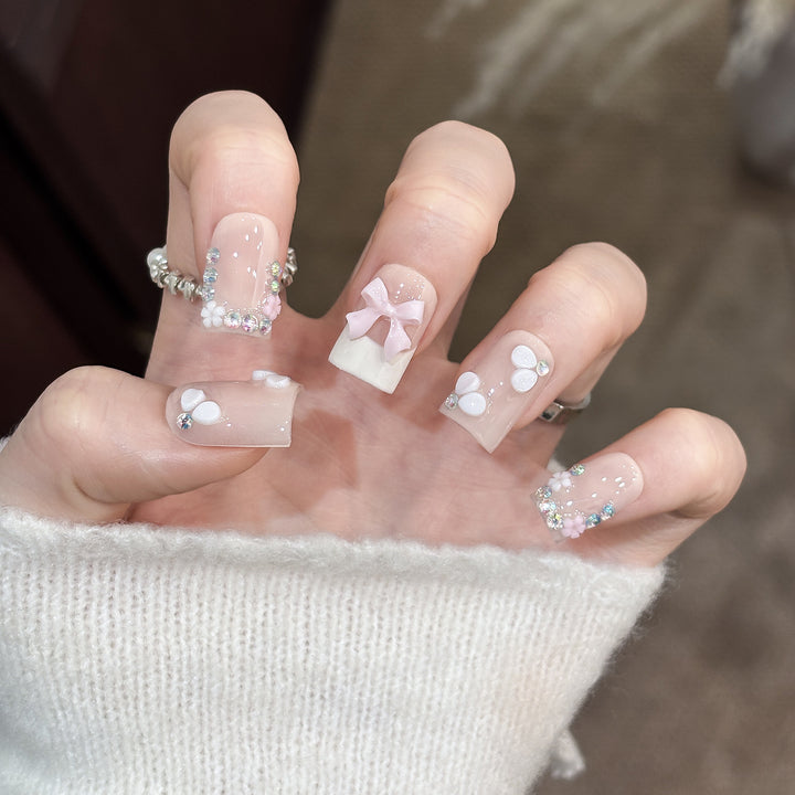 Decorative Nail Art Set with Floral Details and Bow Accents