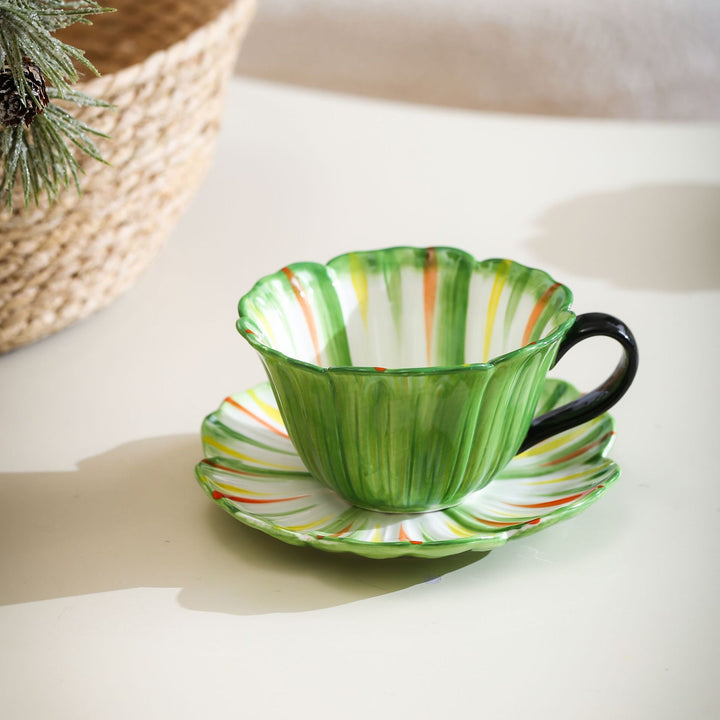 Handcrafted ceramic mug with shell-shaped wave edge and contrasting handle