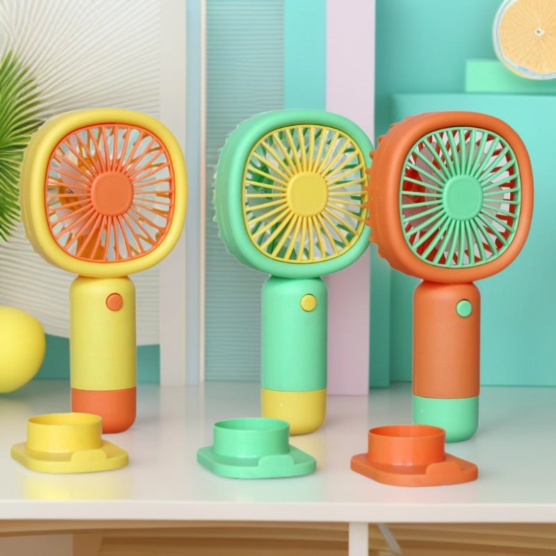 Unisex Handheld Fan with ergonomic design and practical stand function Stornfield