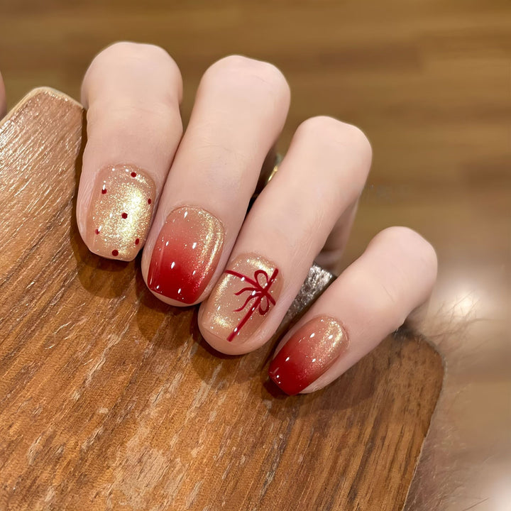 Artificial nails with festive gradient color and elegant decorations Stornfield