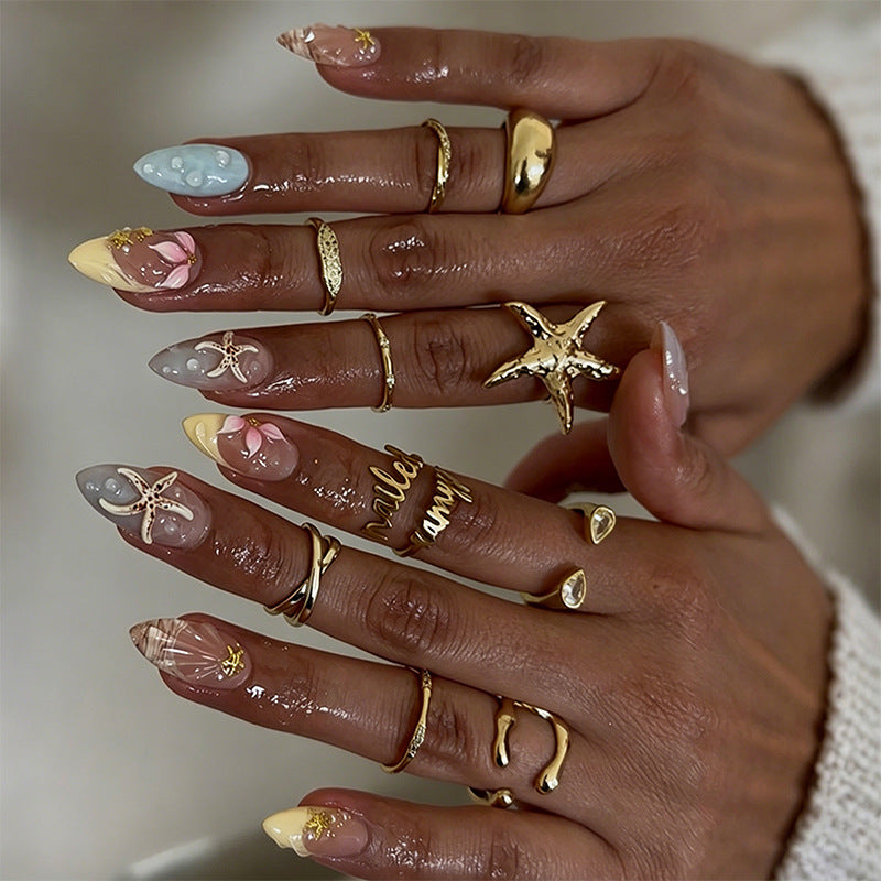 Artificial nails with floral motifs and glitter details Stornfield