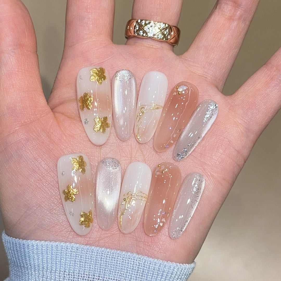 Artificial nails with floral decorations and glitter effects Stornfield