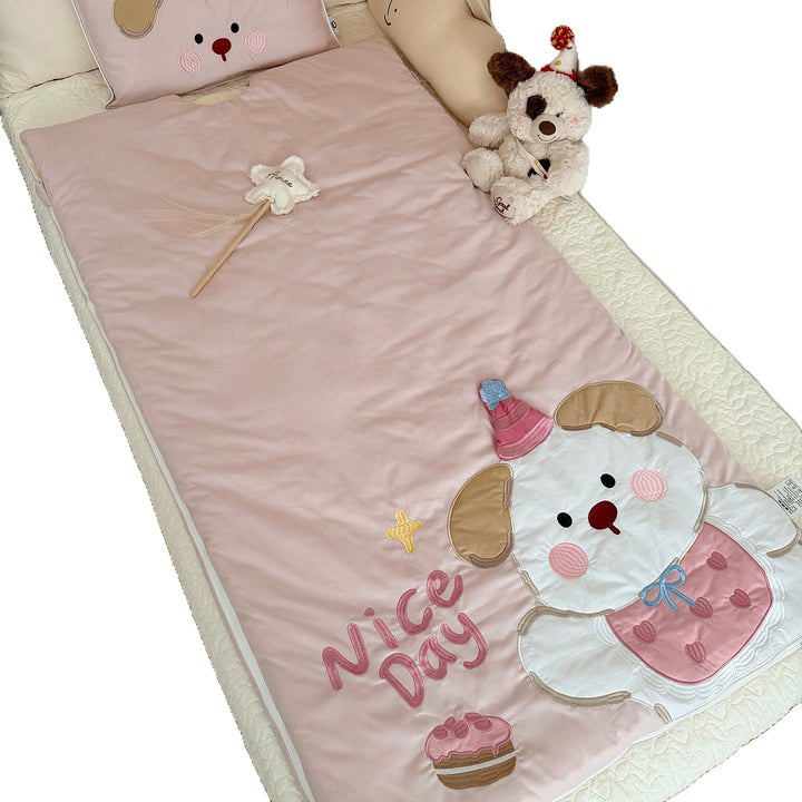 Children's sleeping bag and pillowcase set with quilted dog motif appliqué