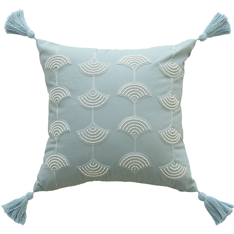Square decorative pillow with embroidered fan motif and decorative tassels