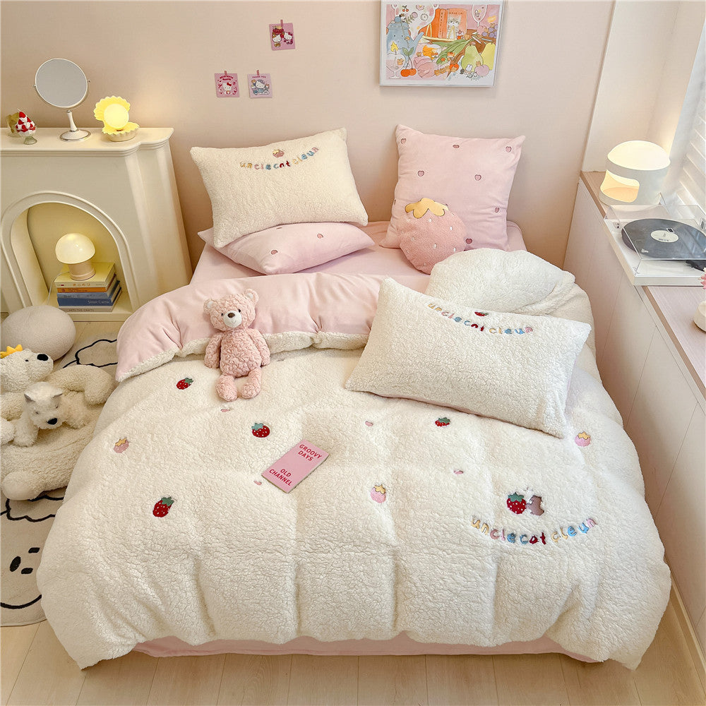 Plush quilt with teddy fleece, embroidered strawberry appliqués and reversible function