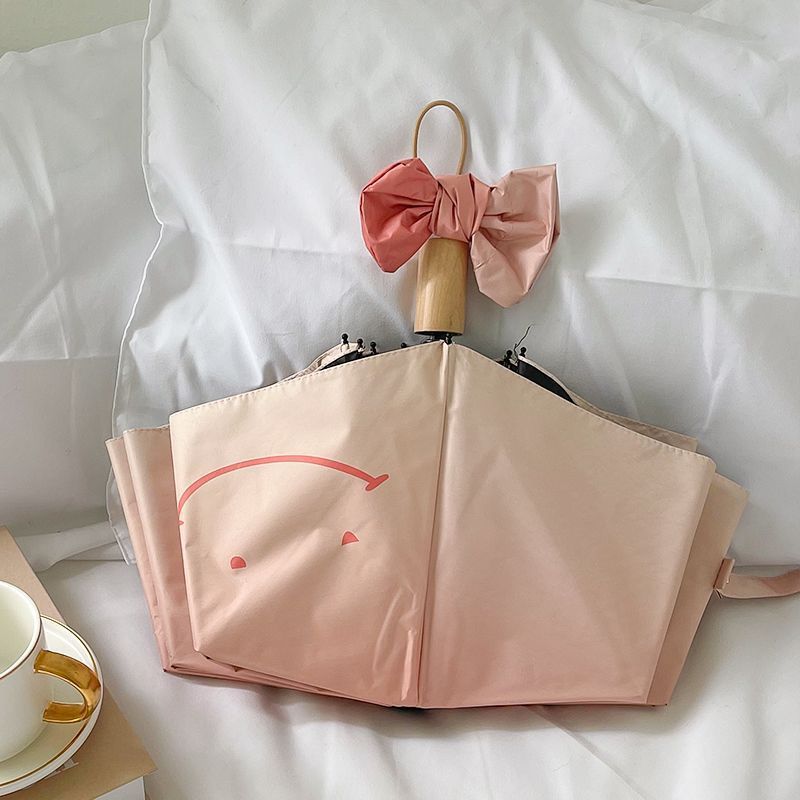 Women's foldable umbrella with playful design and handy wooden handle Stornfield