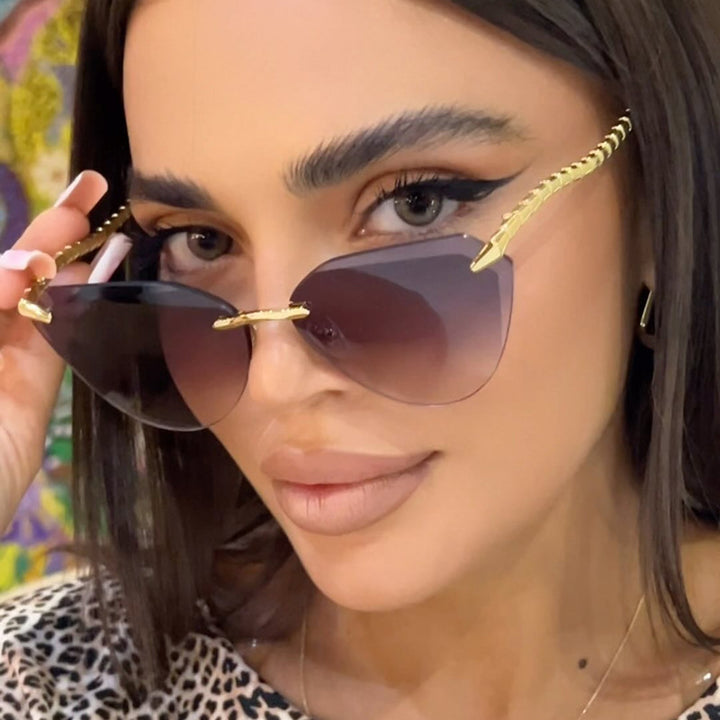 Women's Cat-Eye Sunglasses with unique gold frame design and protective lenses Stornfield