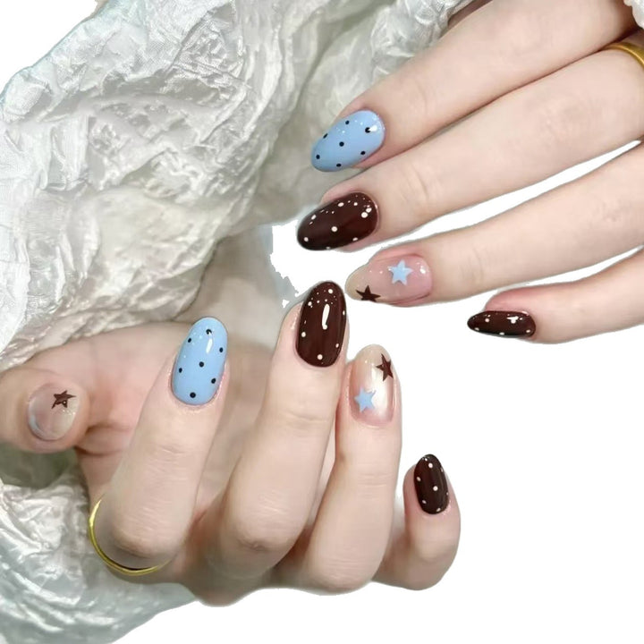Artistic Star-Themed Nail Art Extensions