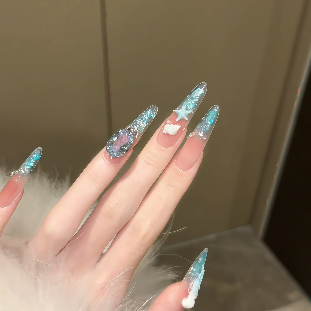 Creative artificial nails with maritime designs and sparkling accents Stornfield