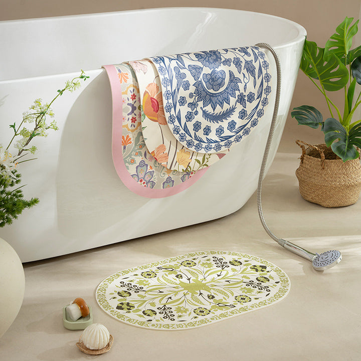 Oval table mat made of wipeable cotton-linen mix with intricate floral print