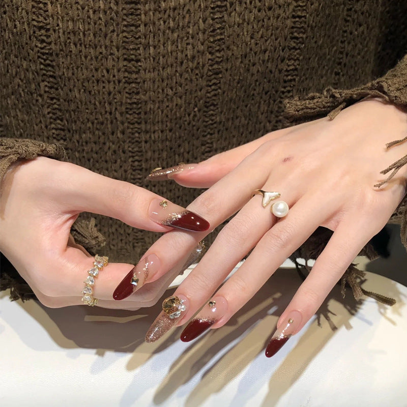Acrylic nail set with elegant glitter design and exclusive embellishments Stornfield