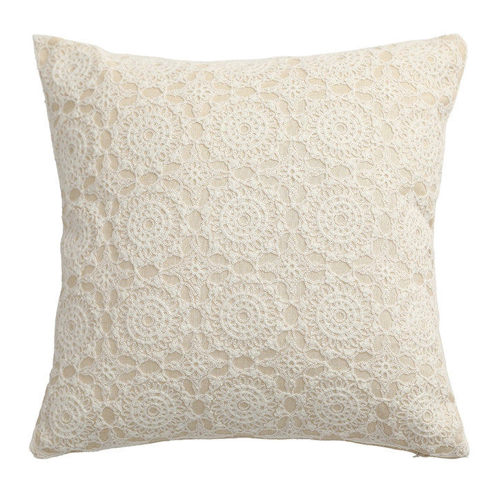 Square decorative cushion with crocheted ornament overlay and linen texture