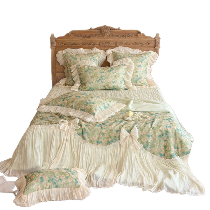Romantic bedding set with ruffles, rose pattern and decorative bows