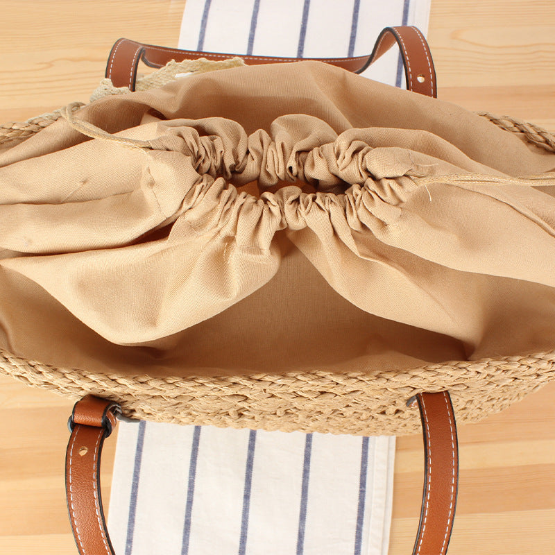 Elegant Braided Raffia Bag with Leather Accent Stornfield