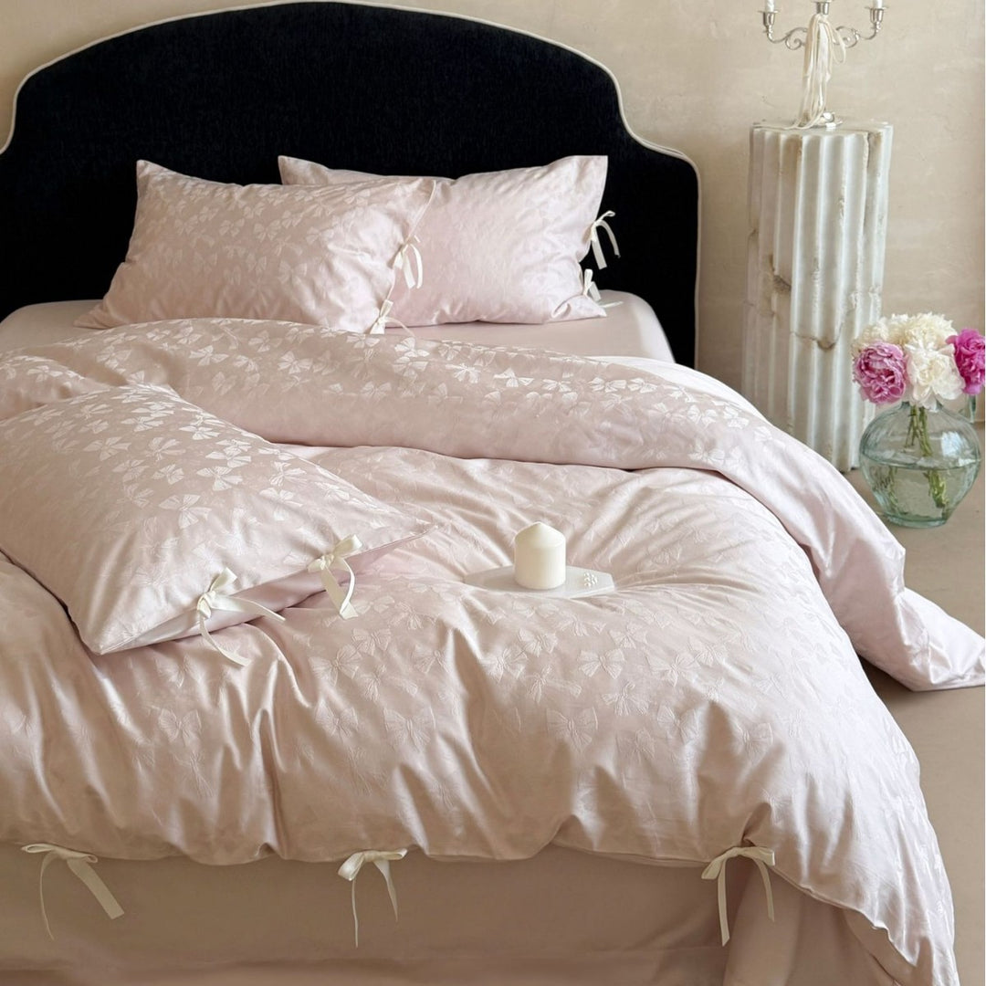 Luxurious cotton satin bed set with delicate ribbon ties and jacquard relief
