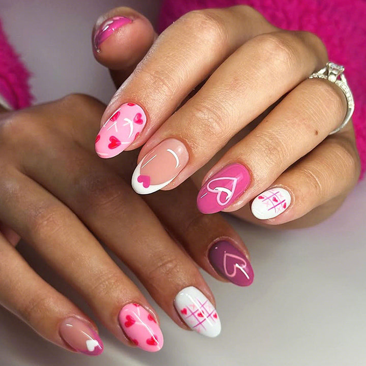Acrylic nail set with romantic heart motif and creative patterns Stornfield