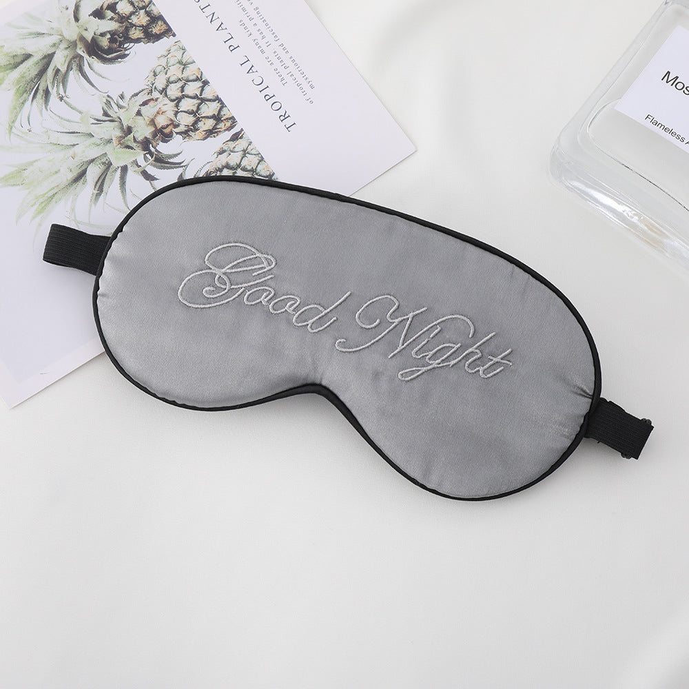 Unisex embroidered contoured sleep mask with decorative text embroidery and adjustable elastic band Stornfield