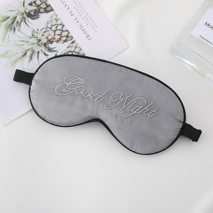 Unisex embroidered contoured sleep mask with decorative text embroidery and adjustable elastic band Stornfield