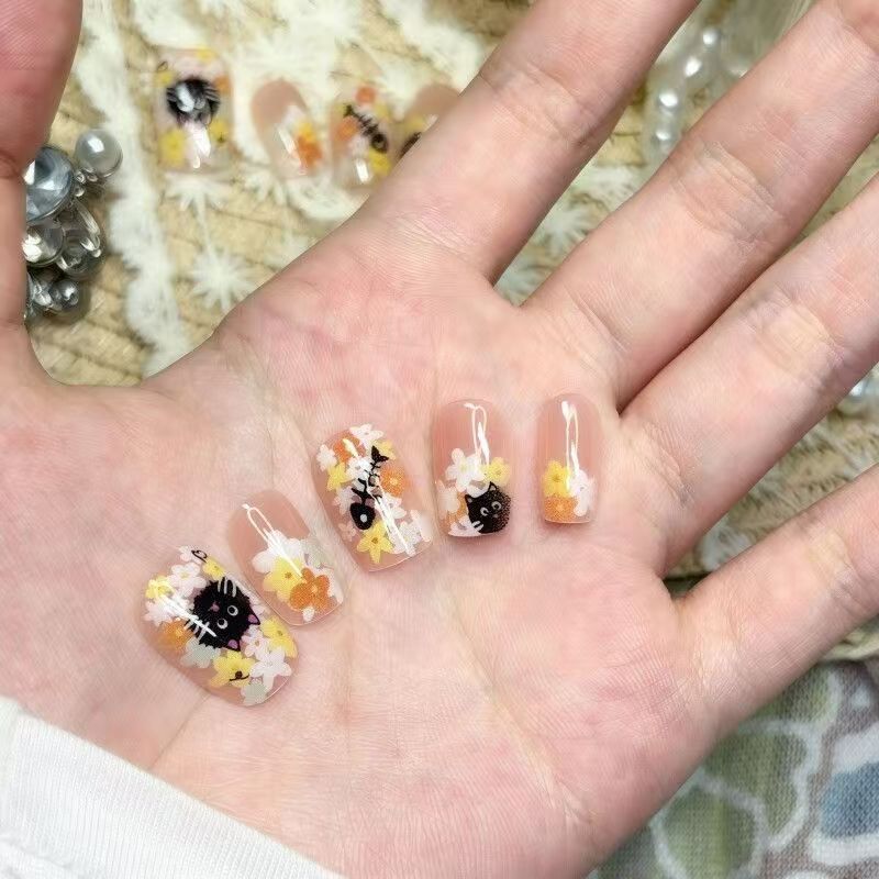 Artificial nails in playful cat flower design Stornfield