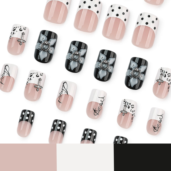 Artful nail extensions with elegant black-and-white design Stornfield
