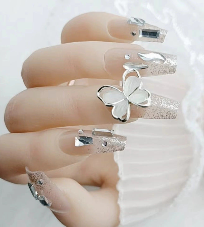 Elegant nail design with pearl embellishment Stornfield