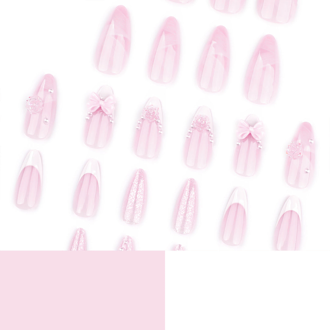 Artistic nail extensions with floral decorations and glitter accents Stornfield