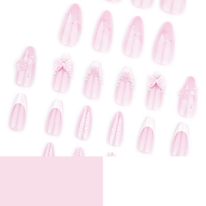 Artistic nail extensions with floral decorations and glitter accents Stornfield
