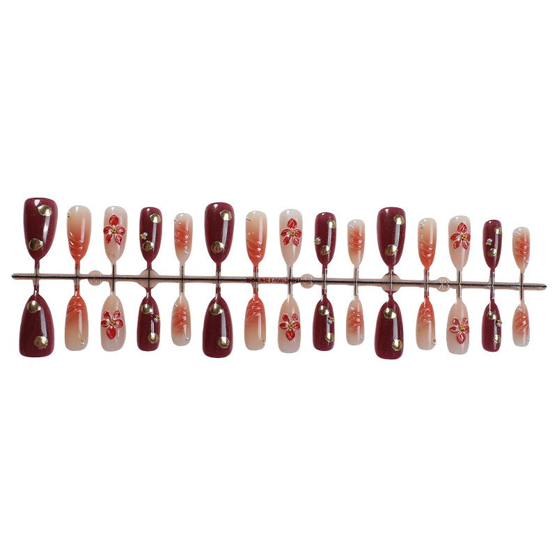 Acrylic nail set with elegant floral accents and glitter details Stornfield