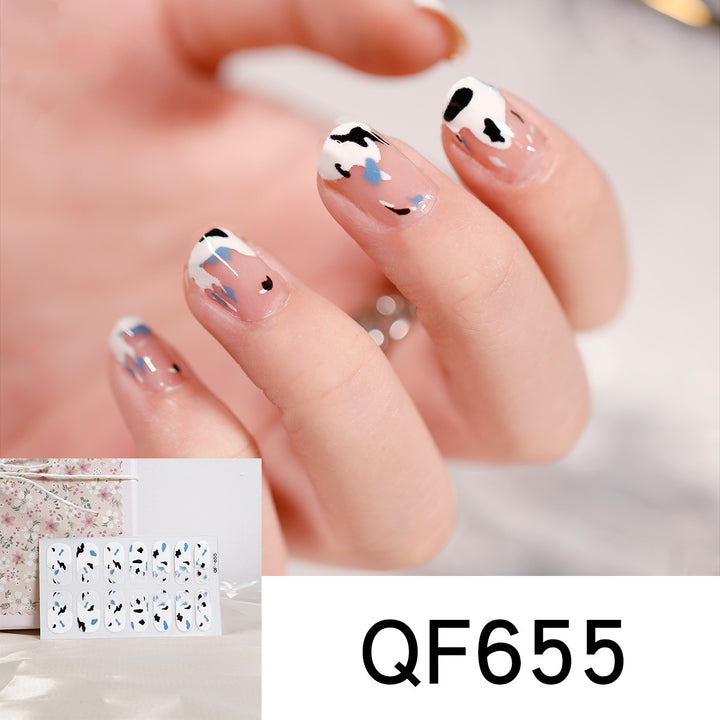 Artificial nail art with heart-shaped designs and soft color gradients Stornfield