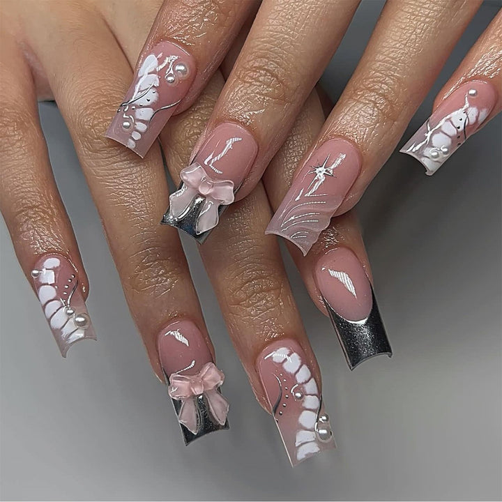 Glamorous artificial nails with elegant decorations Stornfield