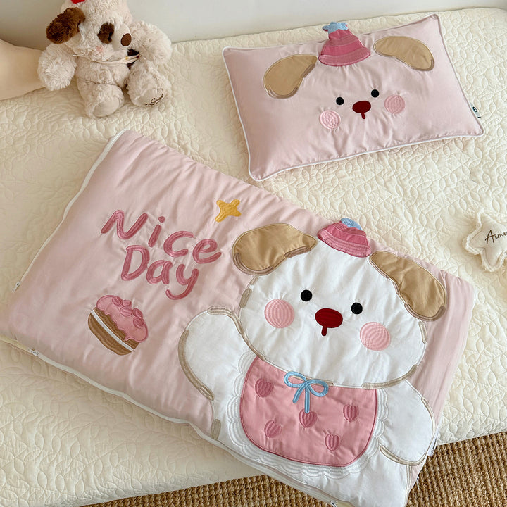 Children's sleeping bag and pillowcase set with quilted dog motif appliqué