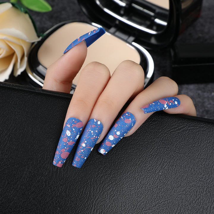 Artistic splatter design artificial nails Stornfield